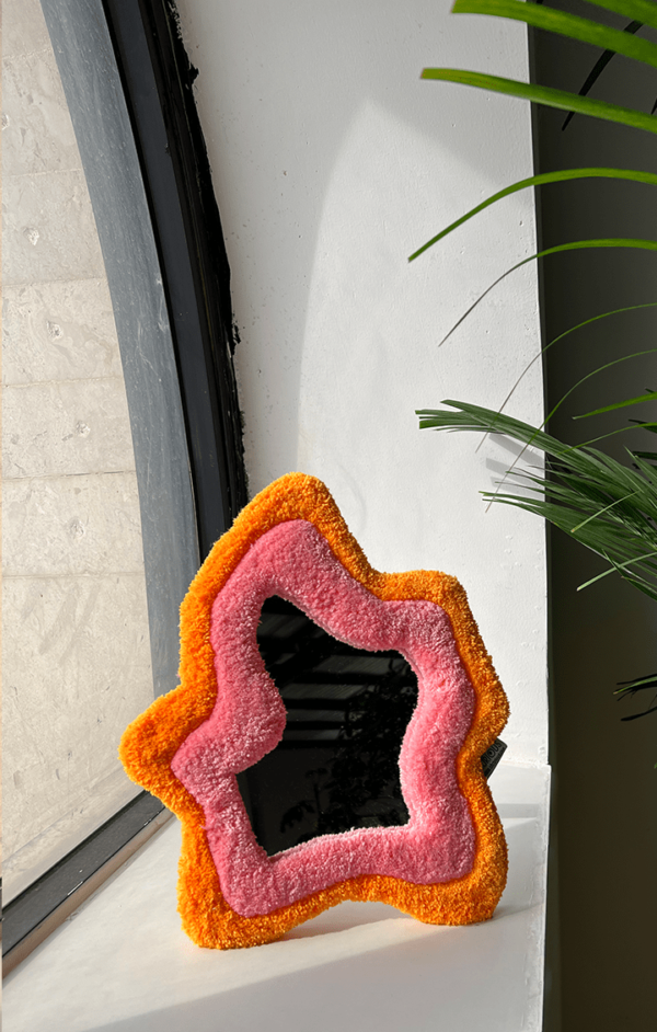 trendy tufted mirror